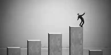 A man riding on top of a skateboard down the side of a ramp.