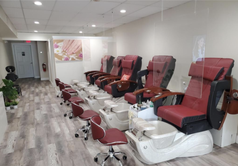 A row of red and white chairs in a room.