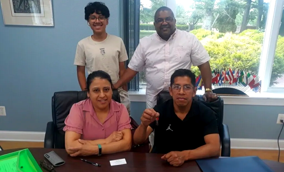 A group of people sitting at a table.